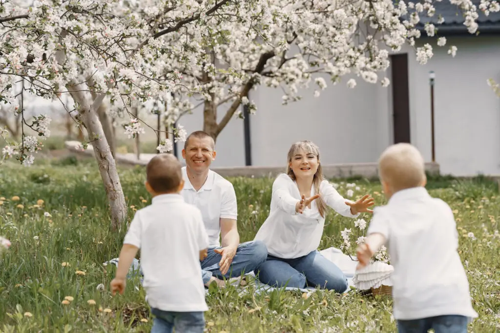 cute-family-playing-summer-yard-best-time-to-sell-a-house