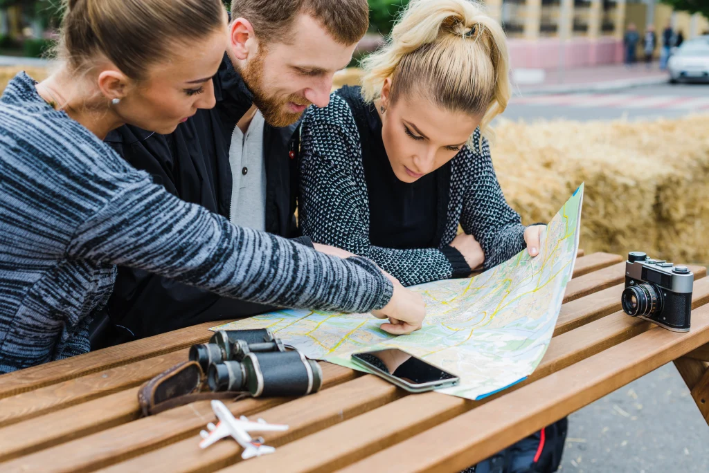 Realtor going over a map of Neighborhood with potential buyers