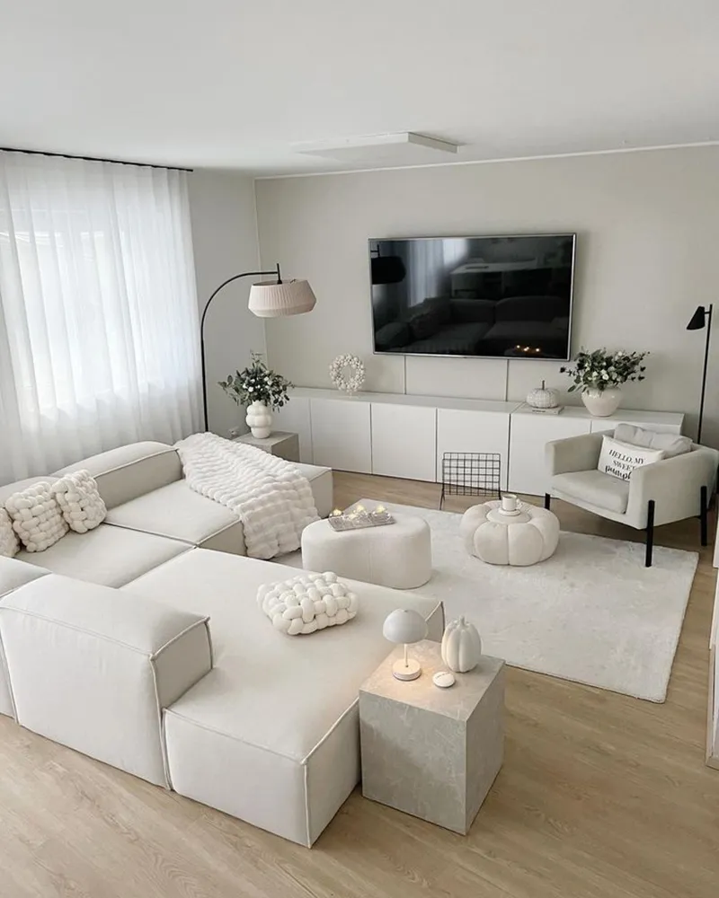 "A clean, minimalist living room with open space, showcasing decluttering and depersonalizing for home staging.