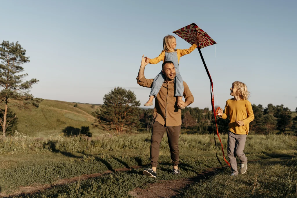 Family enjoying scenic view in the Badlands, North Dakota, showcasing outdoor lifestyle and community spirit.