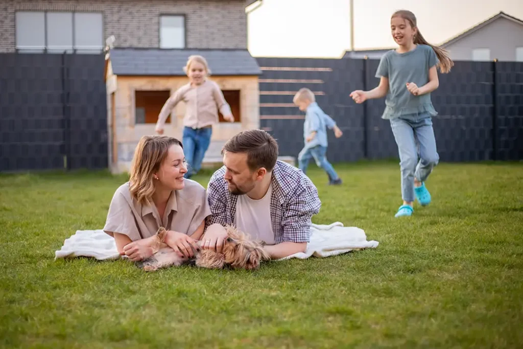Family enjoying a peaceful day outside their home after moving to North Dakota.