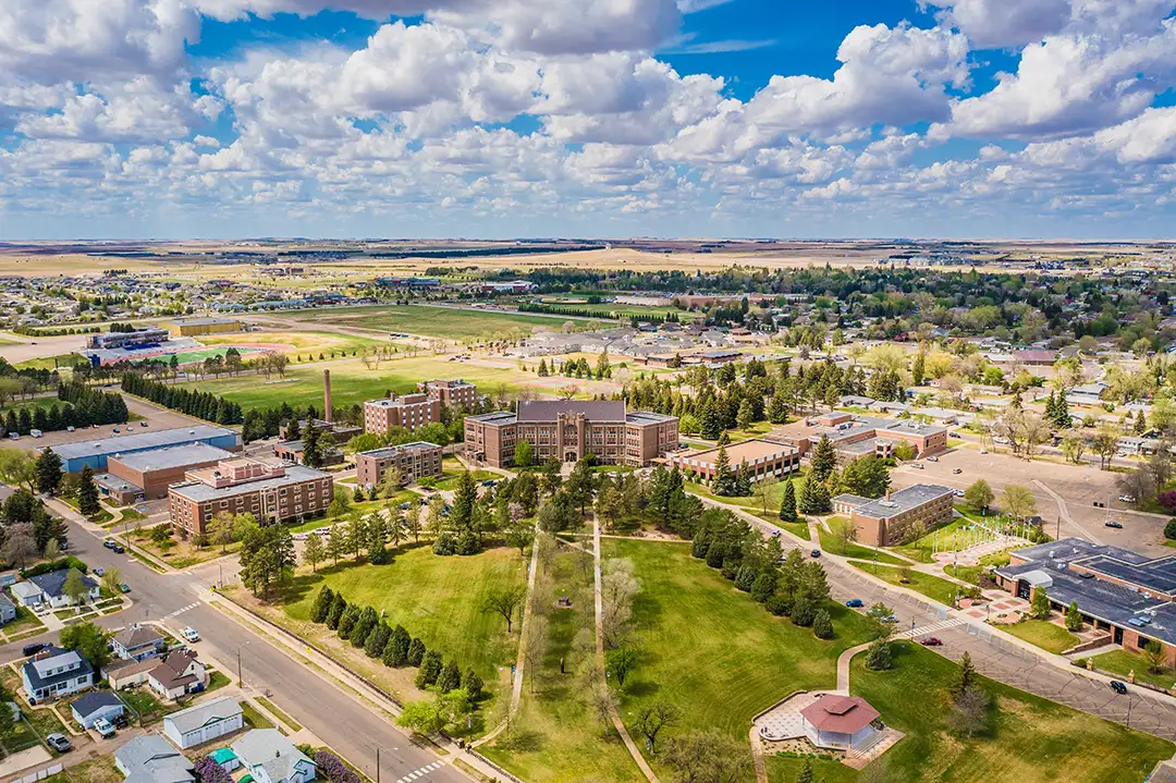 Aerial view of Dickinson, ND showcasing neighborhoods, parks, and local community areas